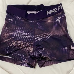Purple design Nike pros three inch spandex